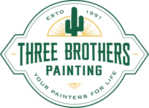 Three Brothers Painting Logo, features the date established at the top, Three Brothers Painting text in the middle, and Your Painters for Life at the bottom all in green text. Near the top is a green cactus with a golden sunset in the background.